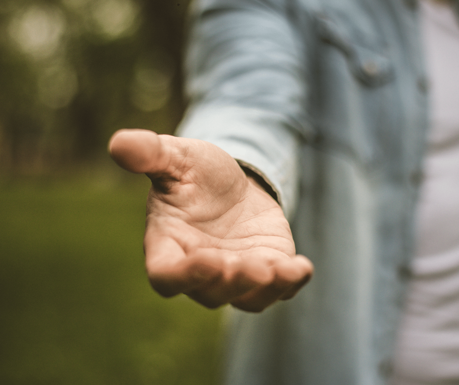 Open hand reaching out to offer help