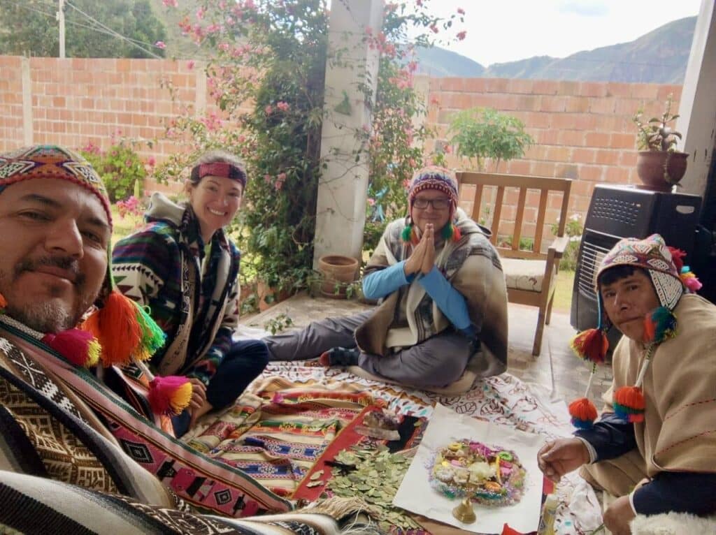 Participants seated together during a traditional Andean ceremony