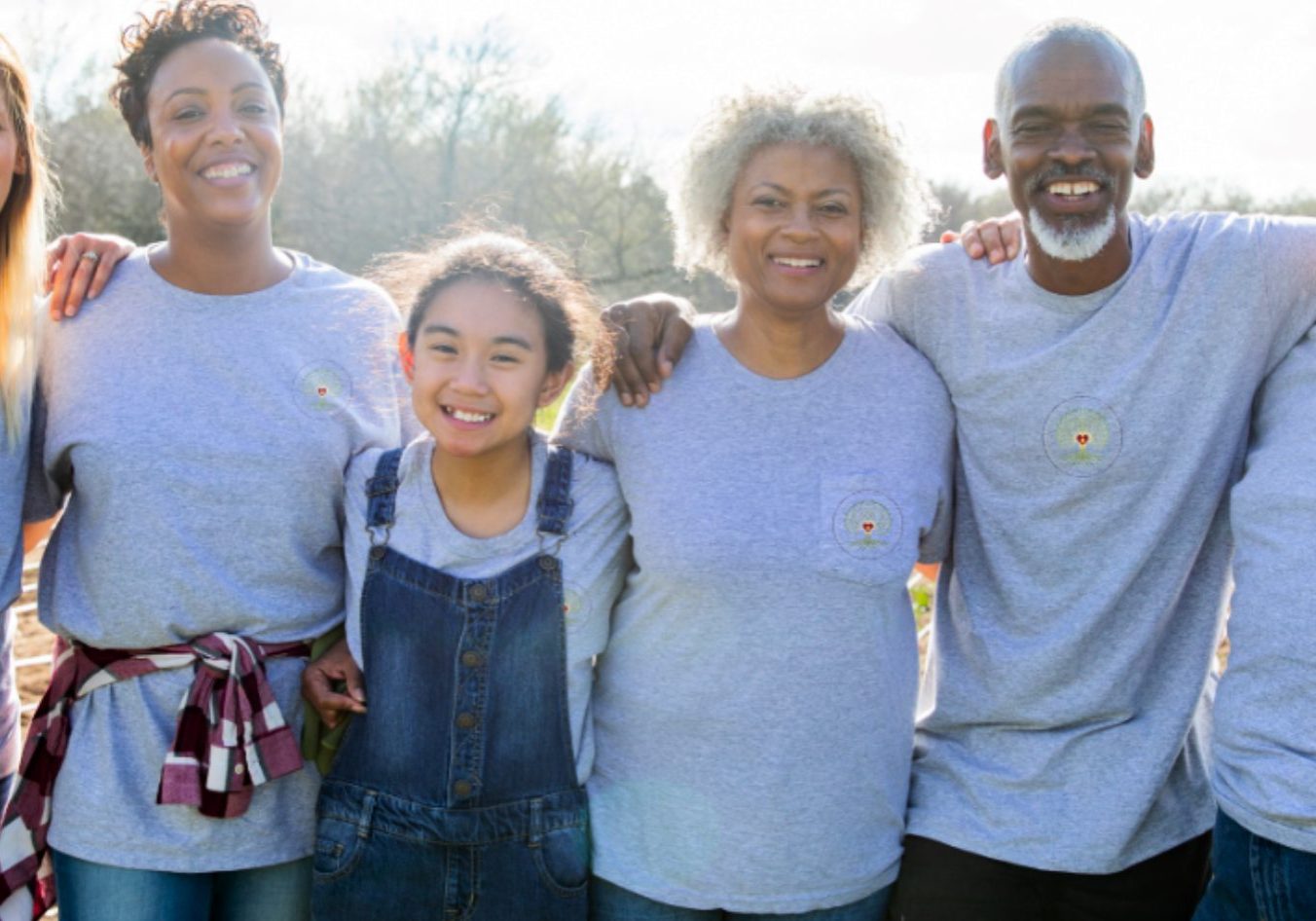 earth group stands arm in arm